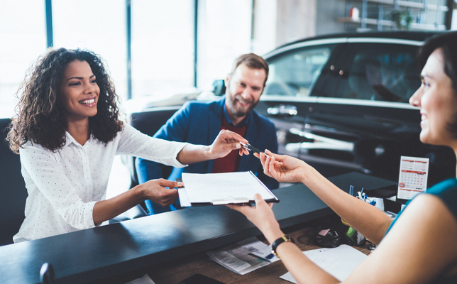 dealer shaking hands with customer